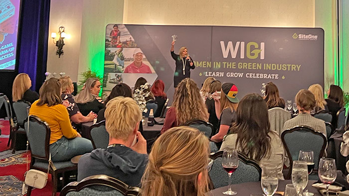 Kate Delaney, a sports reporter and motivational speaker, kicked off the 2022 Women in the Green Industry event by asking attendees to raise their glasses. (Photo: LM Staff)