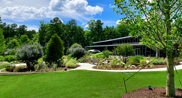 The client’s sustainability center is a space where staff research products on pollinators. Five beehives line the perimeter of the area. GreenView Partners designed a perennial planting for beneficial insects and pollinators. Two Husqvarna Automowers maintain the turf. (Photo: Tyner Tew)