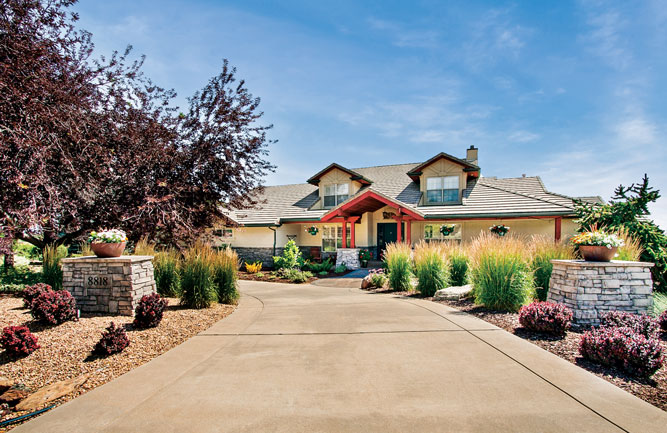 Many of the plantings installed by Alpine Gardens supplement the already existing landscape, which featured many trees and bushes. (Photo: Alpine Gardens)