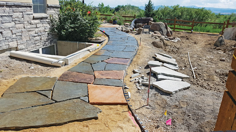New walkways were a request of the clients, who wanted flagstone to match the environment. Alpine Gardens utilized some of the previous stone in the walkway. (Photo: Alpine Gardens)