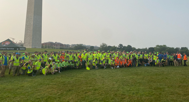 The group of volunteers assigned to the project at the Washington Monument join together before the day of work begins. (Photo: LM Staff)