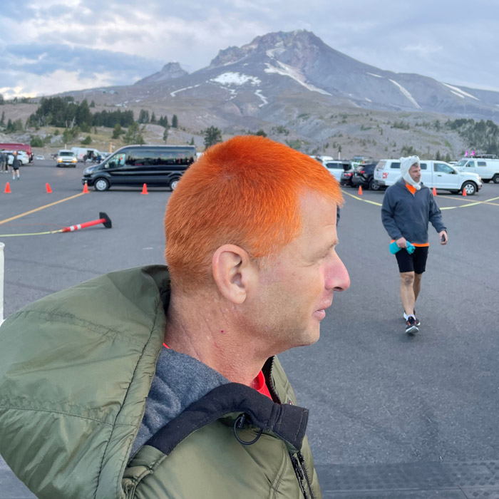 Glenn Armstrong is so dedicated to Team Orange that he dyed his hair orange. (Note, Mount Hood in background). (Photo: Pacific Landscape Management)