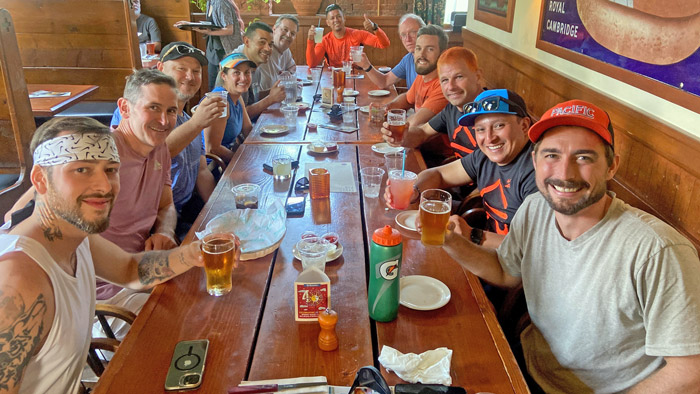 Runners in the first van for Team 1 and Team 2 enjoy a meal together while the members from Van 2 ran their legs. (Photo: Pacific Landscape Management)