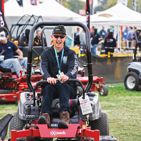 Gabriel Compagna, owner of Unbroken Lawn Care in Simpsonville, S.C., test drives an Exmark mower at Equip Exposition. His company’s slogan is “Stand firm. Hold fast. Stay free.” (Photo: Kriech-Higdon Photography)