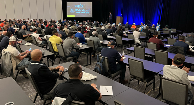 Lex Mason, president of Weathermatic, welcomes the group to SmartCon 2024 and encourages them to get a “Texas-sized” boost to their company. (Photo: LM Staff)