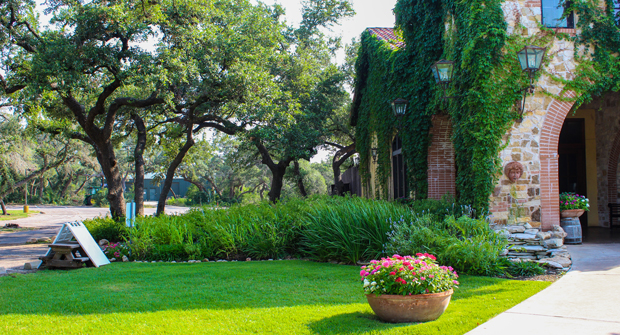 In addition to its many pots and plant beds, this property features several large turf areas. (Photo: Clean Scapes)