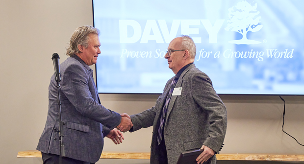 On behalf of the Kent mayor’s office, City Council member Jack Amrhein (right) presented the proclamation of March 15, 2024 as The Davey Tree Expert Company Day to Davey CEO Pat Covey. (Photo: Josh Reuck)