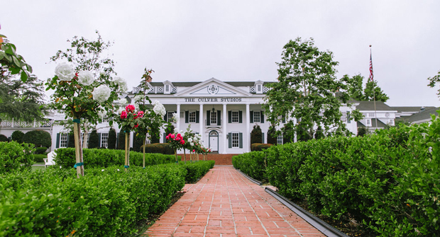 LandCare utilized iceberg roses and azaleas to help preserve the original landscape design of the historic studio. (Photo: LandCare)
