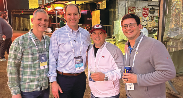 How about those Chiefs?!?: One surefire way to get your photo in the magazine is to wear something with Seth’s beloved Chiefs on it, to an industry event. Dustin Grizzoffi, Embassy Landscape Group, Riverside, Mo., (in Chiefs hat) proves that, with (left to right) Roddy, Jason Mathers, Monarch Landscape Management, Houston, and Nick Novak, Embassy Landscape Group. (Photo: LM Staff)