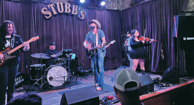 Coffey takes the stage At SmartCon 2024, attendees were treated to a barbecue dinner and a country music concert by Coffey Anderson, singer of Mr. Red, White and Blue. (Photo: LM Staff)