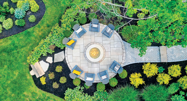One of four patio areas on the property, the contractor utilized Holland Premier pavers from Unilock to replace the previous pavers that are now used in the front driveway. (Photo: Landscapes by Terra)