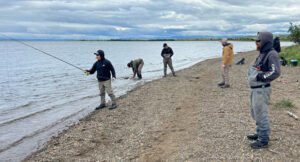 The group, divided in two, took turns fishing for salmon with guides helping them out. (Photo: LM Staff)