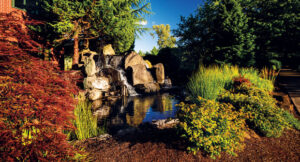 Waterfalls are one of the methods used to keep water moving to prevent algae and keep a calming aquatic aesthetic throughout the property. (Photo: Pacific Landscape Management)