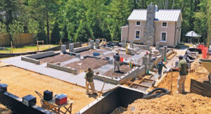An in-progress shot of crews constructing the retaining walls, footings and slabs for the hardscapes. (Photo: McHale Landscape Design)