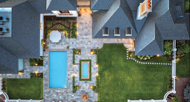 A balustrade fence borders on top of a 30-inch retaining wall that raises the backyard. Winkelmann says the wall was being built before the fence pieces arrived on site, leaving no room for error. (Photo: Ron Ruscio)