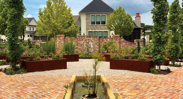 The contractor repurposed an old horse trough found on the site as a water feature. (Photo: EdgeForm Landscape Management)