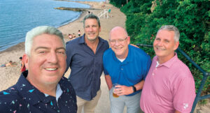 Beach bums: Following the wrap-up of North Coast Media’s annual Content Meeting, some of the Landscape Management team — Jones, Hollister, Group Publisher Bill Roddy and Associate Publisher Craig MacGregor — caught a great view of downtown Cleveland from Huntington Beach. (Photo: LM Staff)