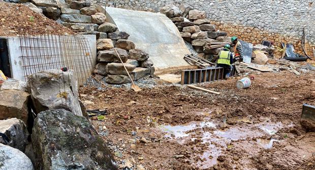 Ruppert used skid-steers to bring in more than 480 tons of boulders to this courtyard area early in the project’s lifecycle. Crews also used a gantry crane and mini-excavator to move them where they sit now. (Photo: Ruppert Landscape)