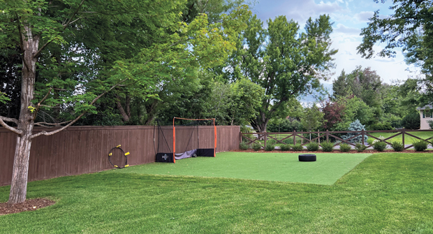 The contractor also installed this artificial turf area so the client’s four children could practice lacrosse and soccer year-round. (Photos: Designs by Sundown)