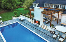 The fireplace serves as the centerpiece and anchor of all the additional spaces.(Photos: Designs by Sundown)