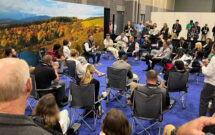 Taylor Milosi leads a Campfire Conversation on the Elevate Expo trade show floor. (Photo: LM staff)