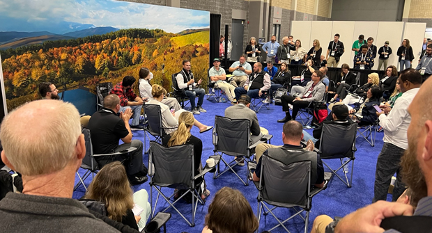 Taylor Milosi leads a Campfire Conversation on the Elevate Expo trade show floor. (Photo: LM staff)
