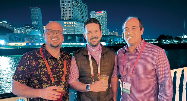 Big views of the Big Easy: (Left to right) Chase Campbell, Fallaize Insurance Agency; Cal Fallaize, Fallaize Insurance Agency; and Nate Negrin, SouthernEEZ Landscaping, enjoyed the ACE Summit riverboat cruise with the New Orleans city skyline as their backdrop.