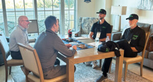 Atticus’ Rob Golembiewski and Michael Sorensen (left) discuss the company’s product line with Alex and Scott Lawn from Greenway Landscape Design and Build. (Photo: LM staff)