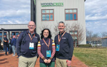 Inside the ropes: During a tour of Hidden Creek Landscaping at GROW! 2025 in Columbus, Ohio, LM’s Scott Hollister (left) and Bill Roddy (right) connected with Dara Dolinsky of Team Engine. (Photo: LM staff)