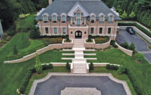 The design of the house is a nod to classic estates, and Haugsjaa says the company still does weekly maintenance with mowing, plant health care, seasonal color, pruning and/or other tasks. (Photo: Rachel Bires and Goldberg and Rodler, Inc.)
