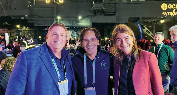 New adventures: Pure Insight’s Carmen Magro, Ph.D., (center) with colleagues Dave Waldmann and Valentine Godin during the Opening Celebration at the GCSAA Conference and Trade Show. (Photo: LM staff)