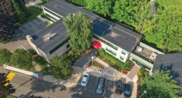 SHU’s red and white colors can be seen throughout the campus in color beds, container displays and hanging baskets. (Photo: Eastern Land Management)
