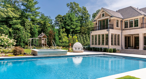 The family wanted to host large gatherings for relatives and friends, leading to an oversized pool and a playset on the lawn for the kids. (Photo: Rachel Bires and Goldberg and Rodler, Inc.)
