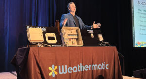 Lex Mason shows off the company’s new SmartLink Connect product line during SmartCon 2025 in Phoenix, Ariz. (Photo: LM staff)