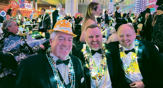 The man in the yellow hat Seth Jones, LM editorial director; Nick Jensen, vice president, Jensen Gardens, Omaha, Neb., and Kayden Glynn share a laugh during the Bacchus Ball in New Orleans. According to Jones, the yellow hat — it flashes lights when turned on — made it safely all the way back to Kansas.