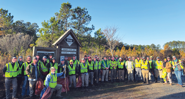 Community service projects like this lake clean-up effort last year are part of the culture at Bland Landscaping. (Photo: bland landscaping)