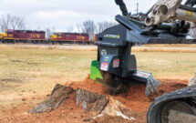 Safety First: Stump grinding attachments use guards over the wheels and deflectors to prevent debris from flying everywhere. (Photo: Loftness)