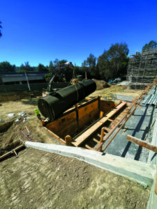 A series of large underground storage tanks are the foundation for the irrigation system on the Citrus Commons project in Sherman Oaks, Calif. All runoff from the property is directed through the landscaping and into these tanks, where it is filtered and recycled for irrigation uses.(Photo: Goldenstate Landscapes)