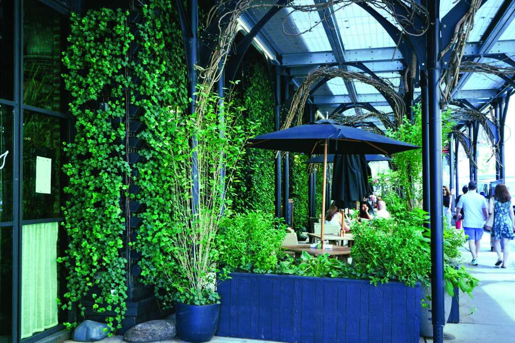 Some parts of the living wall are more susceptible to harsh winds or exhaust vents blowing out hot air, so Wessol says the irrigation system was broken into more zones to provide better control in certain areas. (Photo: John Mini Distinctive Landscapes)