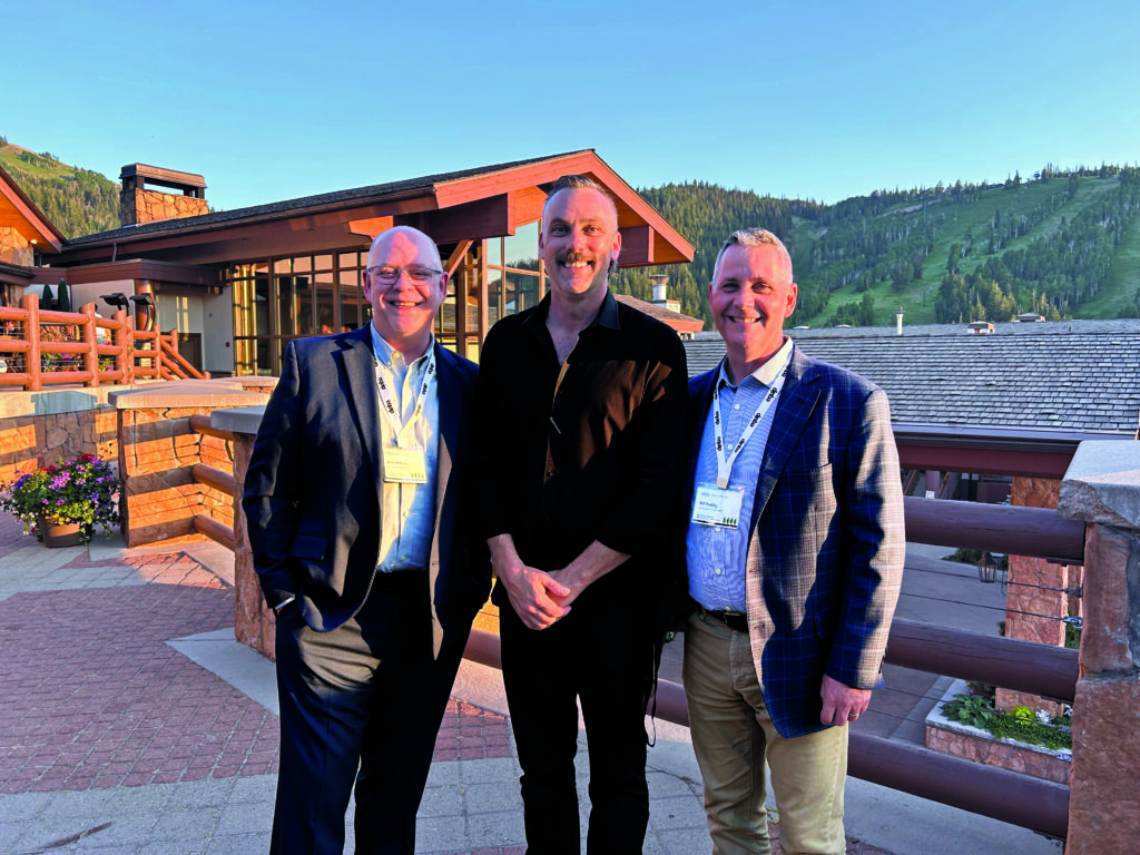 Photo op: Allie Filley (center) is an official Friend of LM who has served as the longtime photographer for OPEI and Equip Expo, so Hollister and Roddy had to take the opportunity to turn the camera on him for a change. (Photo: LM staff)