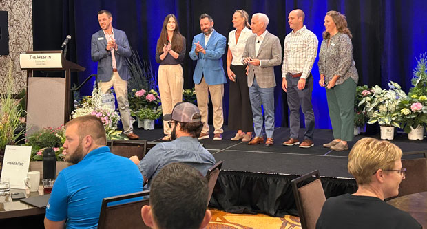 Jeffrey Scott (center) introduces the team from Jeffrey Scott Consulting to attendees at the Summer Growth Summit in Cleveland. (Photo: LM staff)