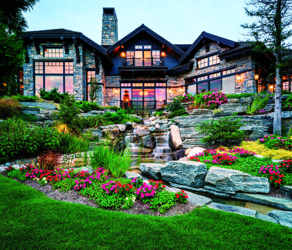 An extensive running water feature was added to the site, surrounded by several planting beds and hardscape elements to soften the design while adding color and depth. (Photo: Chris Major)