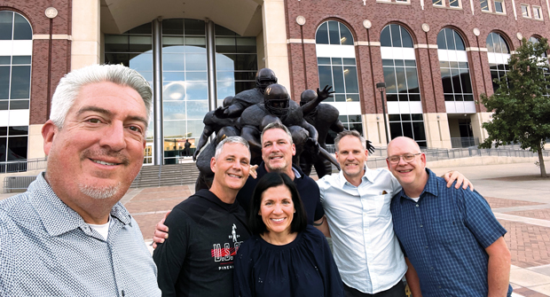 11. Big red reception: The North Coast Media team — Jones, Roddy, MacGregor and Hollister — traveled to Lincoln, Neb. for meetings with Stephanie Hays and Jason Schmaderer (white shirt) with Swanson Russell, and captured this shot outside the home of the Huskers, Memorial Stadium. (Photo: LM staff)