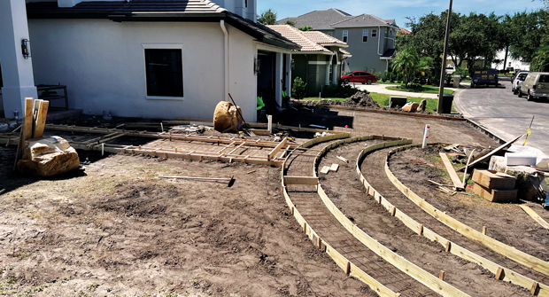 During the landscape design and installation, the exterior of the house was also receiving a full face-lift. (Photo: Landscapes by Randy Lee)