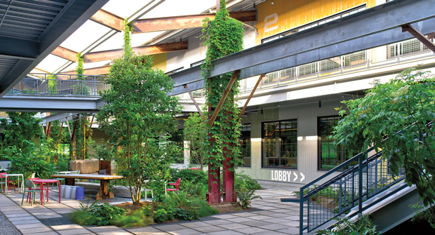 Watts says the interior courtyard with a cut roof is a great example of blending the historical, industrial infrastructure with a modern, beautiful landscape. More than 50 planters are located throughout the site. (Photo: Myatt Landscaping and Construction)