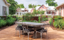 The central courtyard, made of decomposed granite, was created to provide an additional shared space with shade-tolerant plantings of dwarf palmetto palm, inland sea oats and fall aster. (Photo: Brittany Dawn Short)