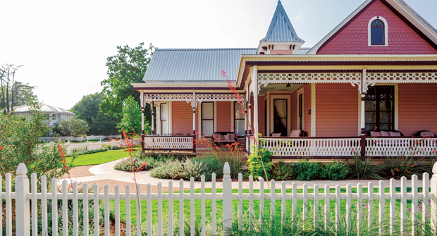 The landmark Queen Anne Victorian-style mansion, built in the early 1900s, was surrounded by a new white picket fence to add to the historic feel of the property. (Photo: Brittany Dawn Short)