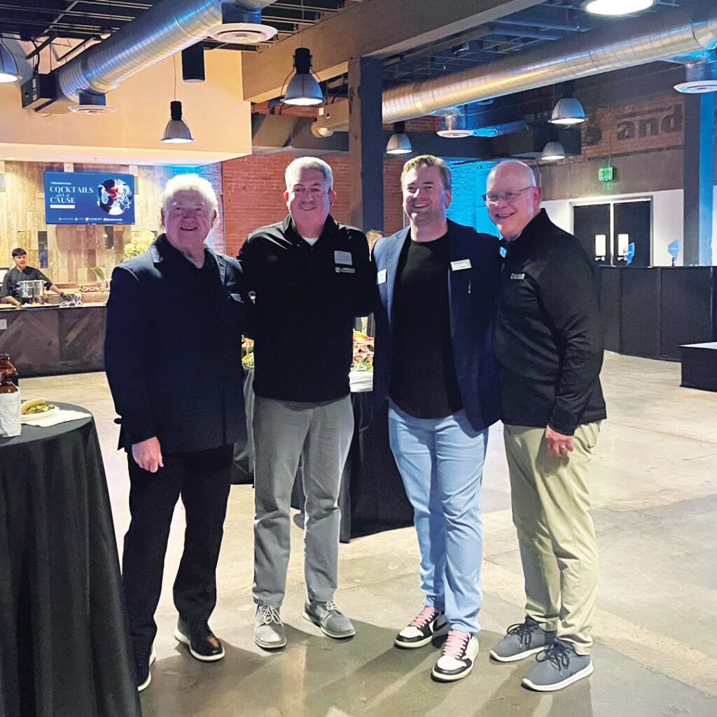 Water works: LM sponsored the installation of a water well to support Weathermatic’s Cocktails for a Cause reception at Elevate. With Jones and Hollister are Weathermatic’s Mike Mason, CEO, and Lex Mason, president. (Photo: LM staff)