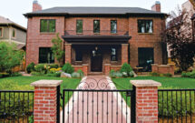 In addition to low maintenance plantings and turf, the redesign came with several hardscape elements, like a louvered pergola, a new courtyard patio and stonework. (Photo: Singing Hills Landscape)