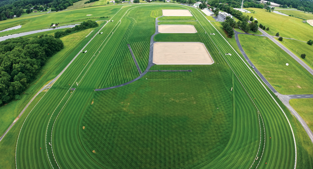 Horse racing returned to Fair Hill in 2025 with the new sand-based Kentucky bluegrass track. Sanchez says the team spent several years carefully growing in and stabilizing the surface, plus building a precise fertility and irrigation program. (Photo: Ruppert Landscape)